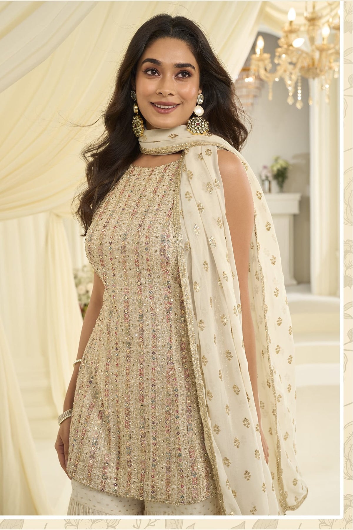 Close-up view of a cream gharara dress in georgette with Swarovski, Zarkan and embroidery work on the bodice and dupatta.