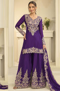 Woman wearing purple indian wedding guest dresses style plazo suit in chinon silk with thread and sequin embroidery, embroidered plazo and dupatta, full-length front view.
