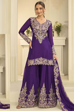 Woman wearing purple indian wedding guest dresses style plazo suit in chinon silk with thread and sequin embroidery, embroidered plazo and dupatta, full-length front view.