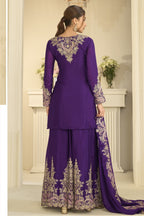 Full-length back view of a purple indian wedding guest dresses style plazo suit in chinon silk with thread and sequin embroidery on the back and dupatta.