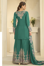 Full-length back view of a teal palazzo suit in chinon silk with delicate thread and sequin embroidery on the back and dupatta.