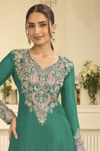 Torso detail view of a teal indian wedding guest dresses style plazo suit in chinon silk with thread and sequin embroidery on the kameez.
