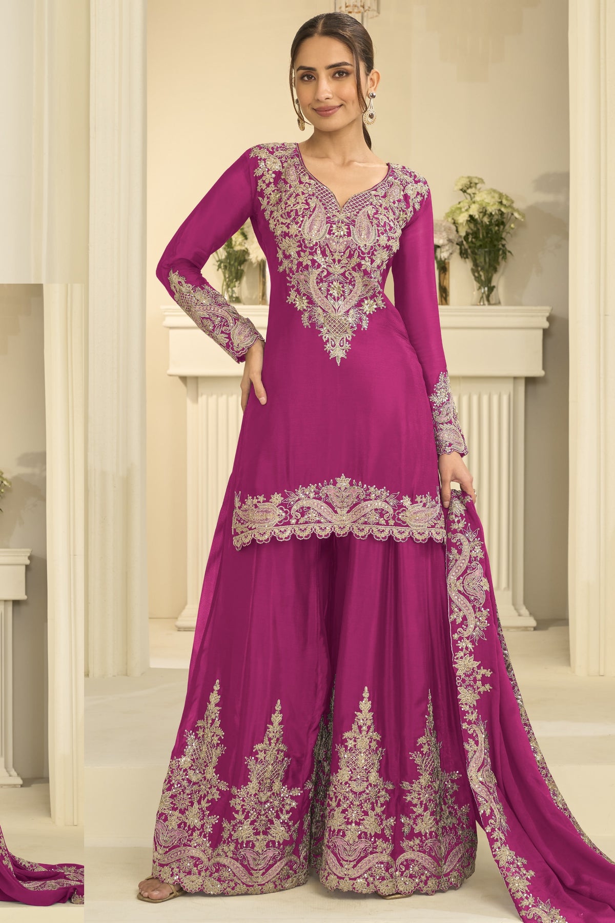 Woman wearing magenta festive wear for women style plazo suit in chinon silk with thread and sequin embroidery, embroidered plazo and dupatta, full-length front view.