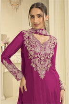 Close-up of a magenta palazzo suit bodice in chinon silk with delicate thread and sequin embroidery on the neckline and sleeves.