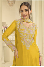 Close-up of a yellow clothes for diwali plazo suit bodice in chinon silk with thread and sequin embroidery on the neckline and sleeves.