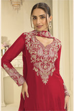 Close-up of a red palazzo dress bodice in chinon silk with delicate thread and sequin embroidery on the neckline and sleeves.