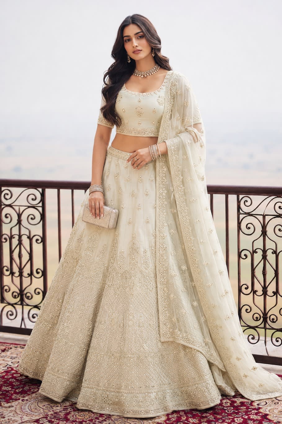 Woman wearing an off white ladies party wear lehenga with embroidery work, half sleeve round neck net choli, full-length front view.