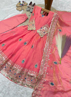 Coral pink childrens indian outfits girls anarkali set flat lay with cotton pant and embroidered fendy silk dupatta.