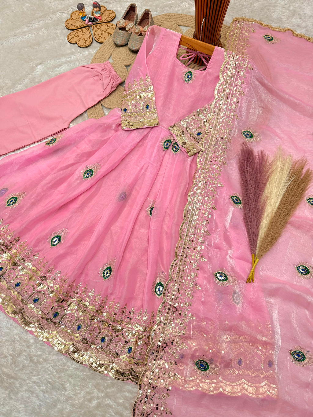Light pink indian kidswear girls anarkali set flat lay showing the full three-piece set with embroidered dupatta.