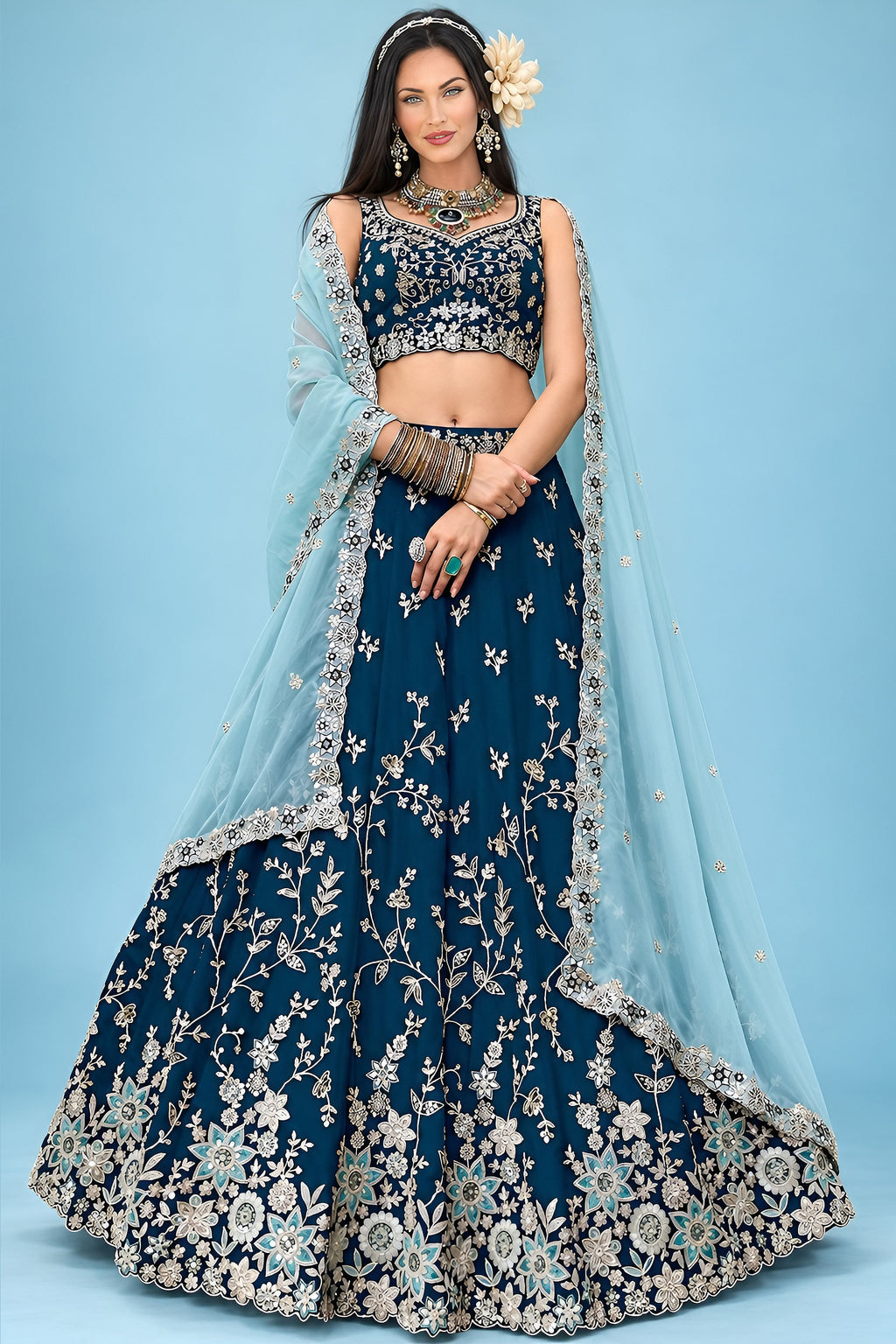 A navy blue lehenga for wedding guest with a sleeveless sweetheart blouse, flared rangoli silk skirt and matching dupatta, shown in a full front view.