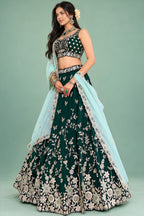 Front view of a dark green mehendi lehenga with a sweetheart neckline blouse and zari, sequin and thread work across the rangoli silk set.