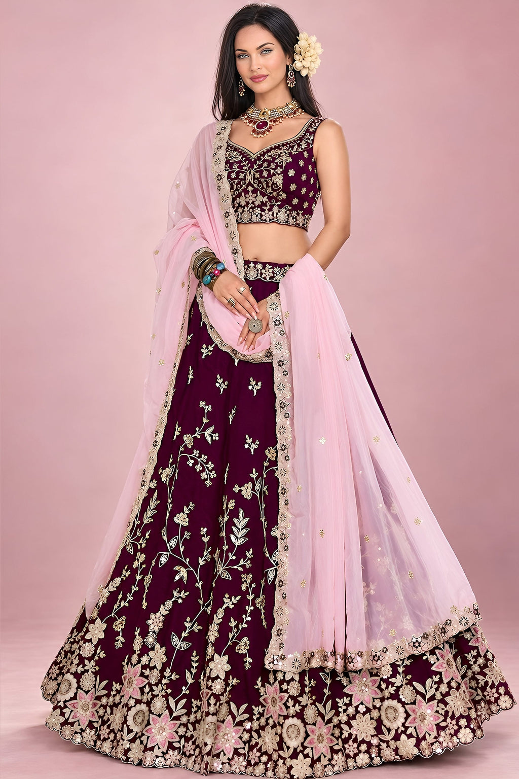 Front view of a maroon wedding reception lehenga in rangoli silk with zari, sequin and thread work on the blouse and flared skirt.