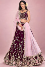Front view of a maroon wedding reception lehenga in rangoli silk with zari, sequin and thread work on the blouse and flared skirt.