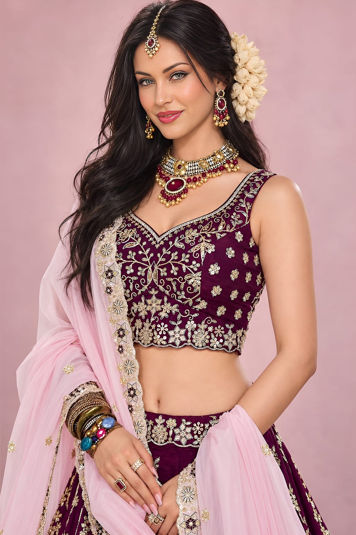 Half view of a maroon wedding reception lehenga with a sweetheart neckline blouse, flared skirt and zari, sequin and thread detailing.