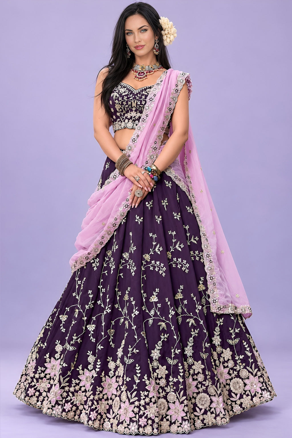 Front view of a dark purple lehenga choli for sangeet, showing the sleeveless sweetheart blouse and the zari, sequin and thread work.