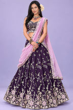 Front view of a dark purple lehenga choli for sangeet, showing the sleeveless sweetheart blouse and the zari, sequin and thread work.