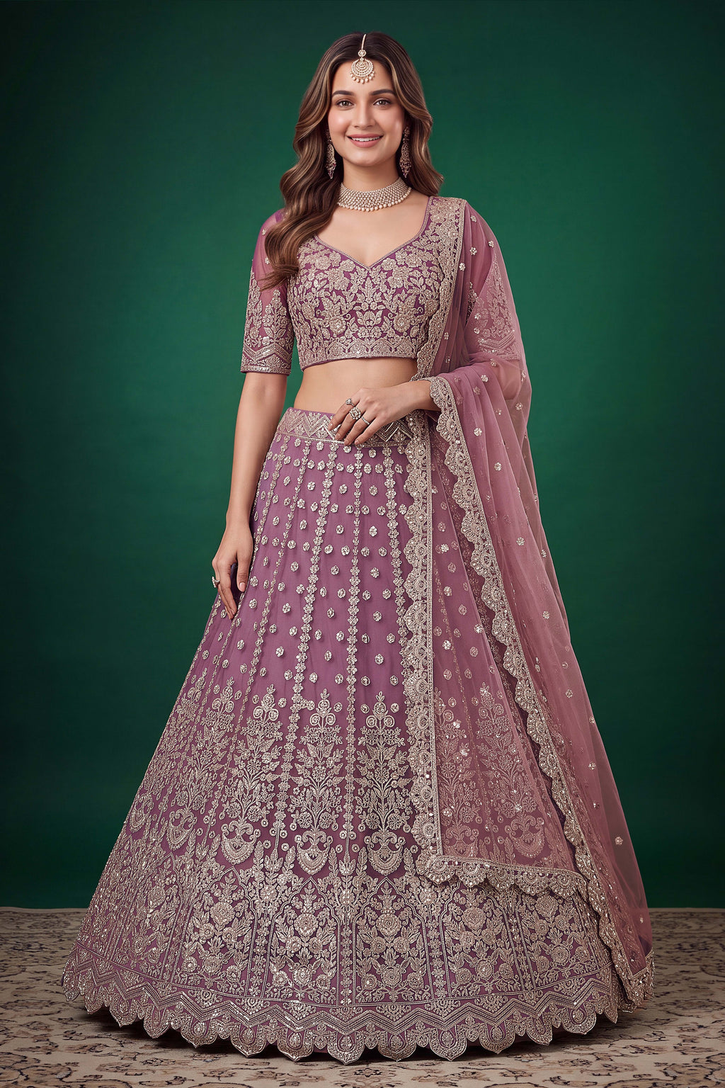 Woman wearing a light purple sangeet lehenga in net with zari, dori and sequins work, sleeveless sweetheart blouse, full-length front view.