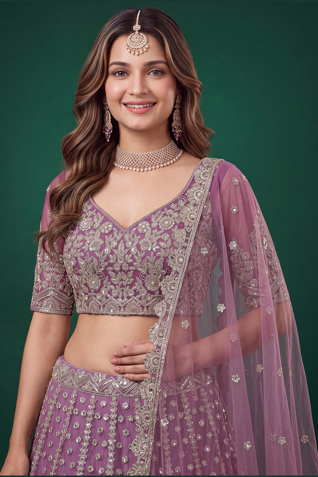 Full-length side view of a light purple engagement dresses for women lehenga in net with zari, dori and sequins work on the flared skirt.