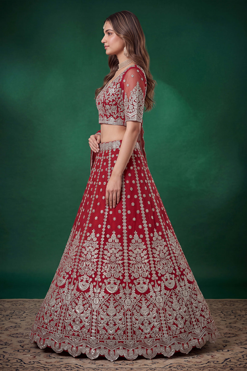 Alternate view of a red reception lehenga in net with zari, dori and sequins work throughout on the sleeveless blouse and lehenga.