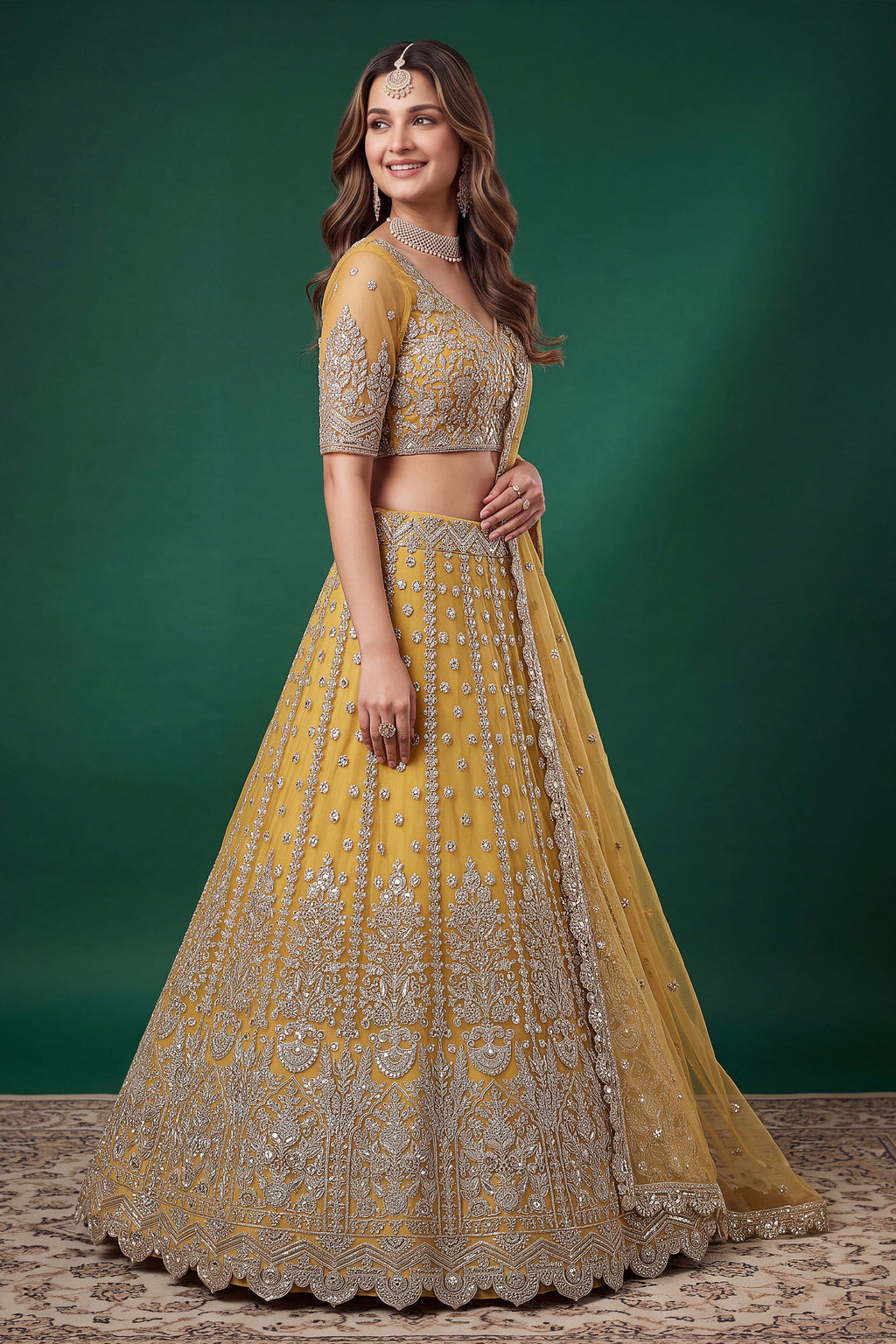 Alternate view of a mustard yellow reception lehenga in net with zari, dori and sequins work on the sleeveless blouse and lehenga.