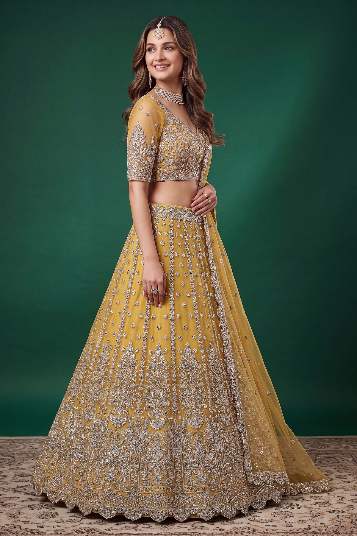 Alternate view of a mustard yellow reception lehenga in net with zari, dori and sequins work on the sleeveless blouse and lehenga.