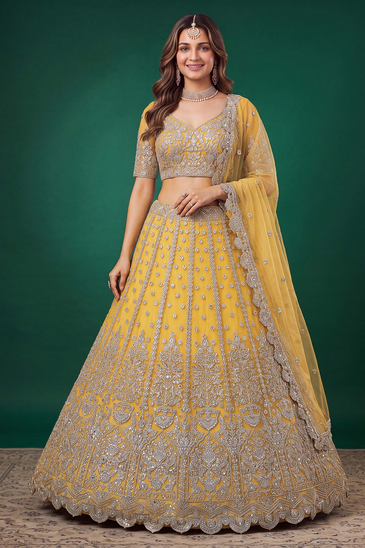 Woman wearing a mustard yellow haldi outfits lehenga in net with zari, dori and sequins work, sleeveless blouse, full-length front view.