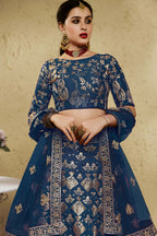 Close-up view of a blue sangeet lehenga in art silk with detailed zari and sequin embroidery work on the blouse and lehenga skirt.