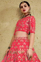 Alternate full-length view of a pinkish red reception lehenga in art silk with zari and sequin embroidery work on the blouse and lehenga.