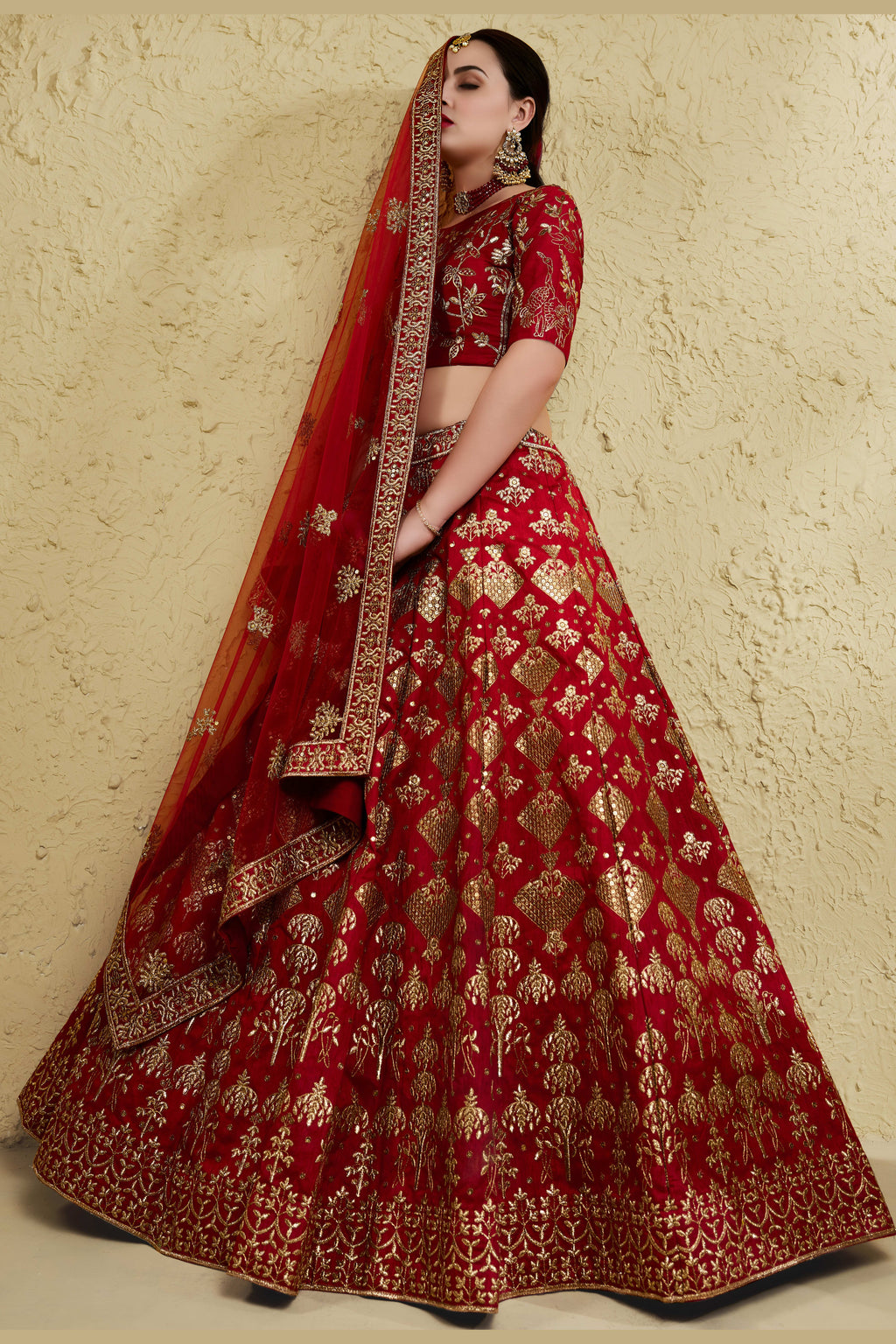 Additional view of a red reception lehenga in art silk with zari and sequin embroidery work on the half sleeve blouse and lehenga.