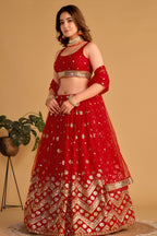 Additional view of a red engagement dresses for women lehenga with zari and sequin embroidery throughout throughout the outfit.