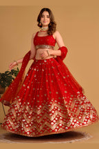 Alternate full-length view of a red engagement lehenga with zari and sequin embroidery on the sleeveless choli and lehenga.