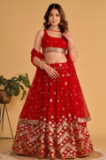 Woman wearing a red lehenga for wedding with zari and sequin embroidery, sleeveless round neck choli, full-length front view.