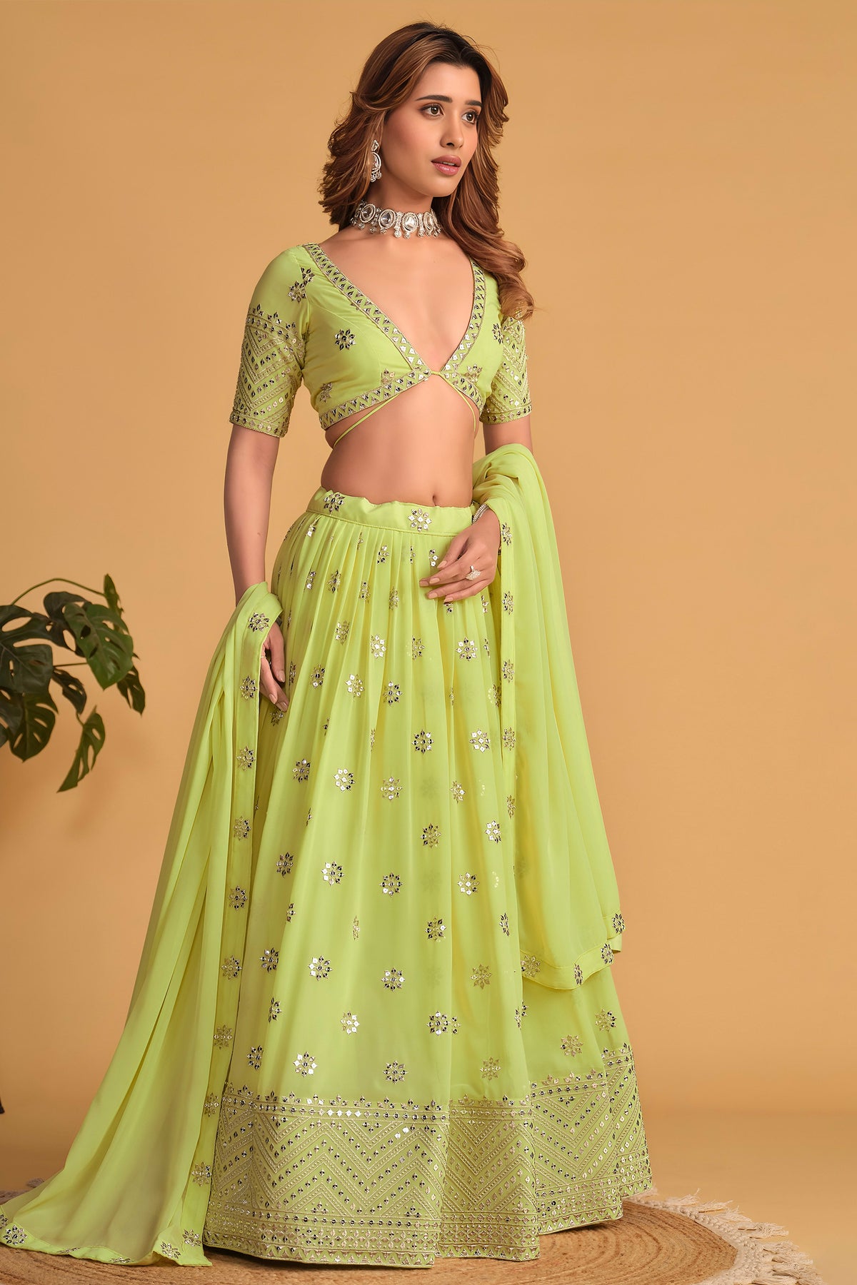 Additional view of a neon yellow engagement dresses for women lehenga with zari and sequin embroidery throughout the outfit.