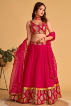 Additional view of a reddish pink engagement dresses for women lehenga with zari and sequin embroidery throughout the outfit.