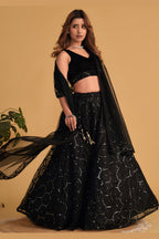Additional view of a black engagement dresses for women lehenga with zari and sequin embroidery throughout throughout the outfit.