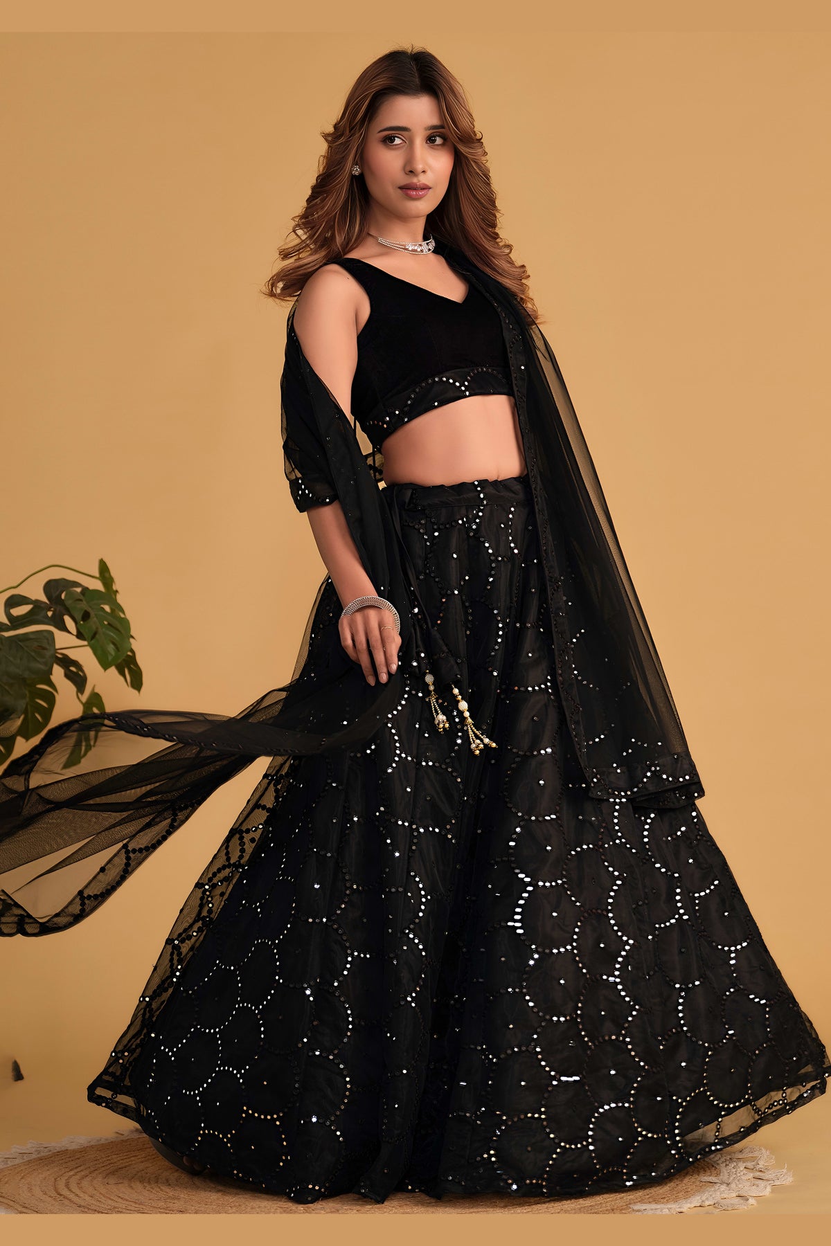 Additional view of a black engagement dresses for women lehenga with zari and sequin embroidery throughout throughout the outfit.