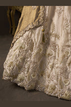 Light beige lehenga choli for wedding with fendy silk dupatta, full length view on model.