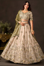 Back side of light beige sangeet lehenga, zari and sequin work on fendy silk skirt.