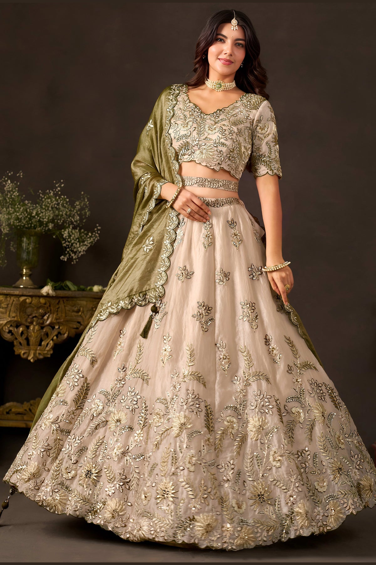Back side of light beige sangeet lehenga, zari and sequin work on fendy silk skirt.