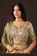 Detail of light beige lehenga choli dupatta edge, zari and sequin border.