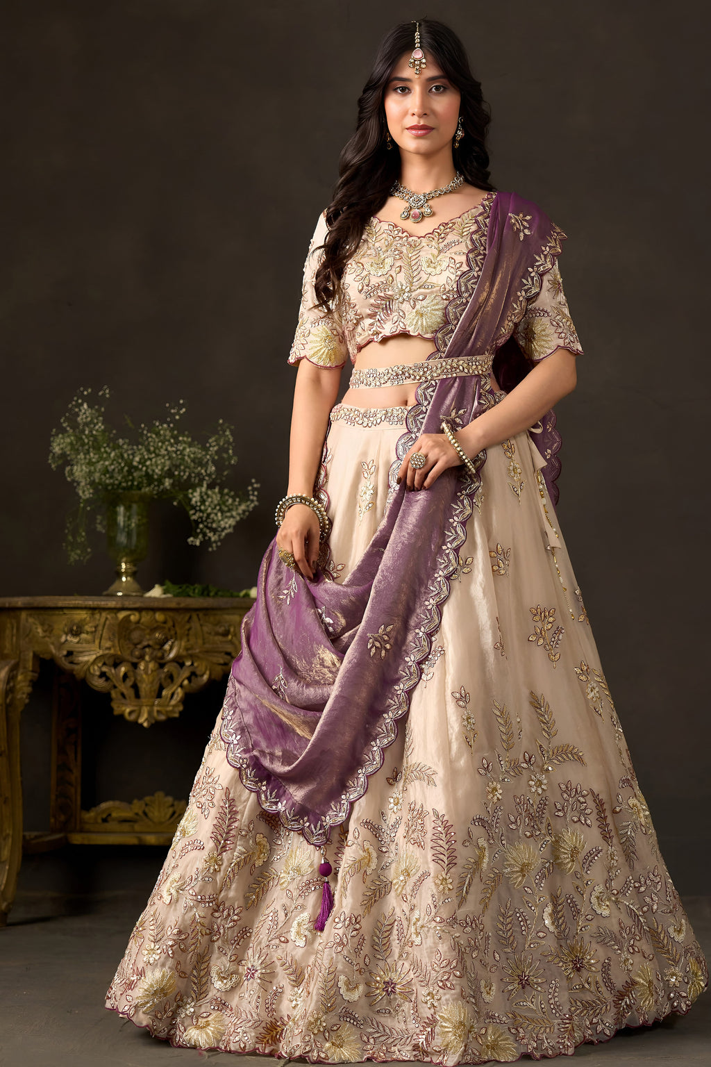 Close-up of light beige silk lehenga blouse, thread and sequin embroidery on fendy silk.