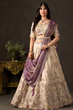 Close-up of light beige silk lehenga blouse, thread and sequin embroidery on fendy silk.