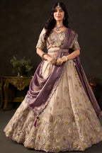 Detail of light beige lehenga waistband, zari and sequin border work on fendy silk.
