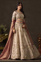 Light beige silk lehenga choli flat lay, skirt with zari thread work panels.