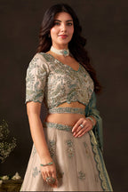 Close-up of light beige lehenga choli blouse, zari and sequin embroidery detail on fendy silk.