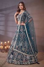 Teal sequin lehenga, close-up of the blouse and choli embroidery detailing, featuring thread and sequins embroidery work on net fabric.