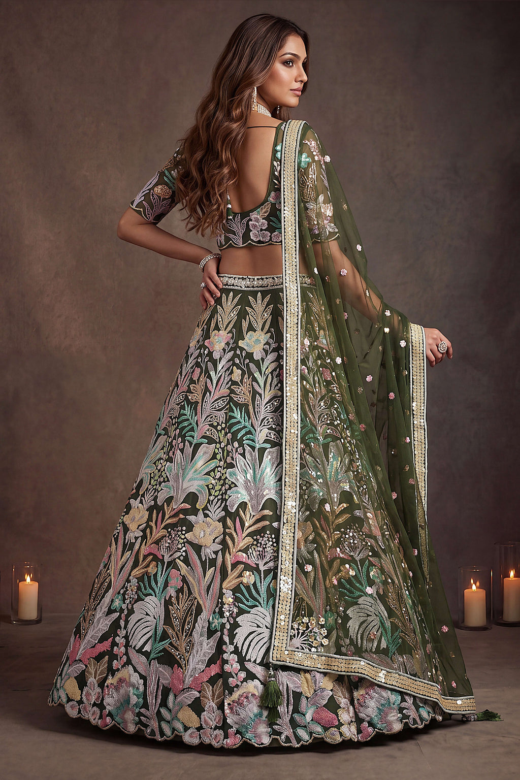 Olive Green sangeet lehenga, shown from the back view displaying the backside embroidery work, featuring thread and sequins embroidery work on net fabric.