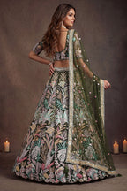 Olive Green sangeet lehenga, shown from the back view displaying the backside embroidery work, featuring thread and sequins embroidery work on net fabric.