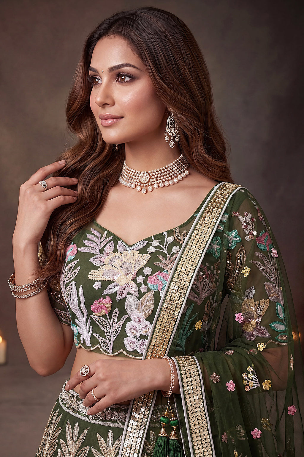 Olive Green embroidered lehenga, detail view of the thread and sequins embroidery on net fabric, featuring thread and sequins embroidery work on net fabric.