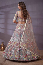 Dusty Rose bridesmaid lehenga, shown from the back view displaying the backside embroidery work, featuring thread and sequins embroidery work on net fabric.